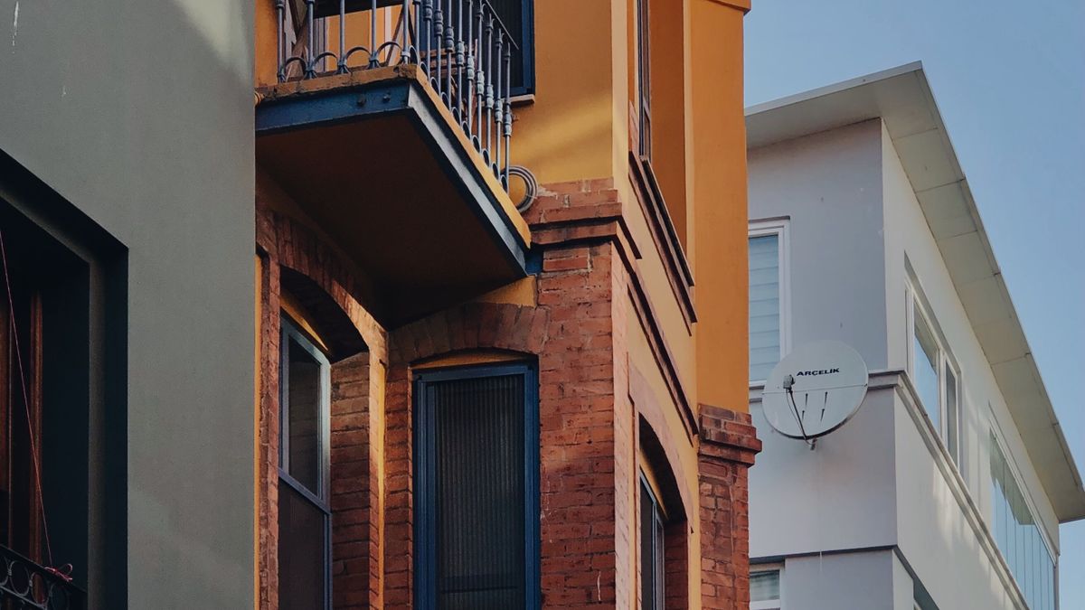Colorful residential buildings with balconies and brick facades